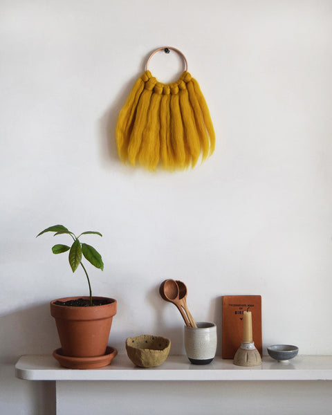 Mini woven wall hanging, designed and handcrafted in the UK from ethically sourced pure merino wool in mustard.