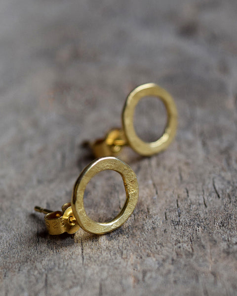 Handmade gold vermeil stud earrings with a matt hammered surface inspired by textures found in the natural world.
