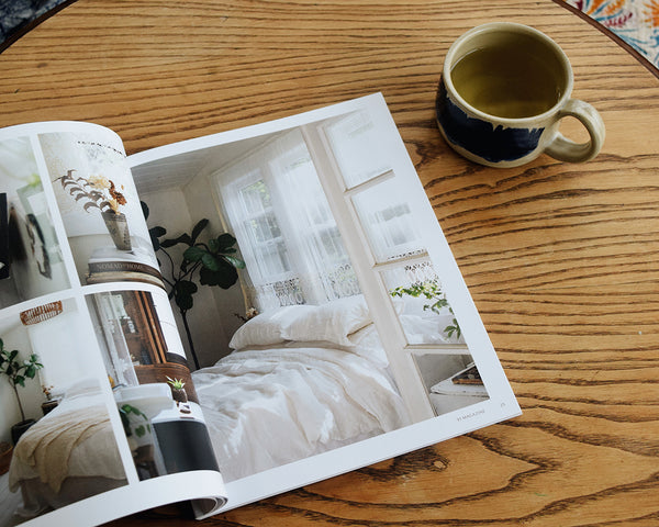 91 Magazine Issue 16 is an independent interiors and lifestyle magazine. Magazine on table with cup of herbal tea.