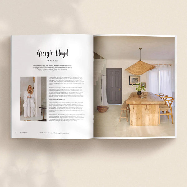 Open pages of 91 Magazine Issue 19 featuring a Georgie Lloyd home tour, with a light-filled dining room, wooden table, chairs and woven pendant light.