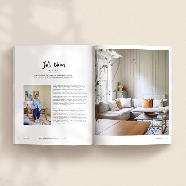 Open pages of 91 Magazine Issue 19 featuring a Julia Davies home tour, with a light-filled living room, pale sofa, wooden coffee table and natural materials.