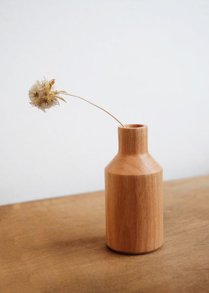 Ash wooden mini vase with a dried flower