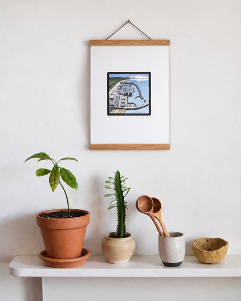 Brighton Marina fine art print displayed on a wall with plants and handmade homeware