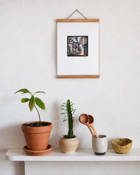 Hanningtons Lane Brighton fine art print displayed on a wall with plants and handmade homeware