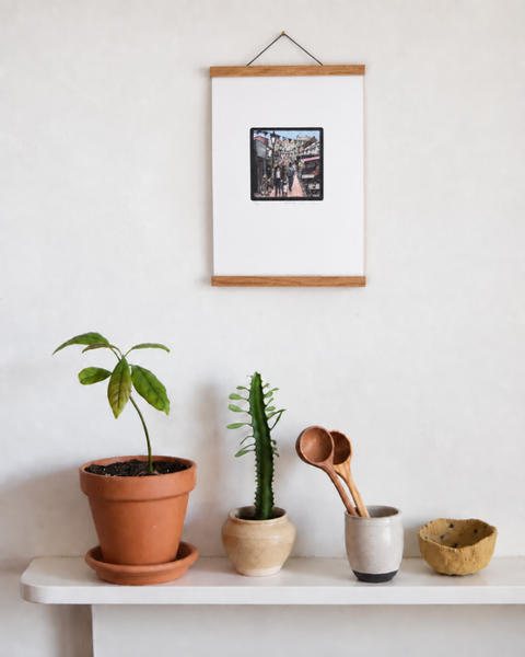 North Laine Brighton fine art print displayed on a wall with plants and handmade homeware