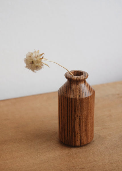 Olive ash wooden mini vase with a dried flower