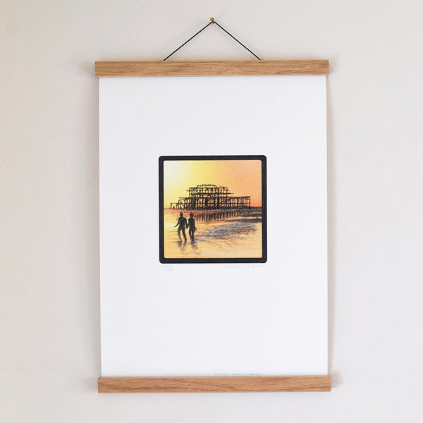 Brighton West Pier fine art print displayed in an oak poster hanger