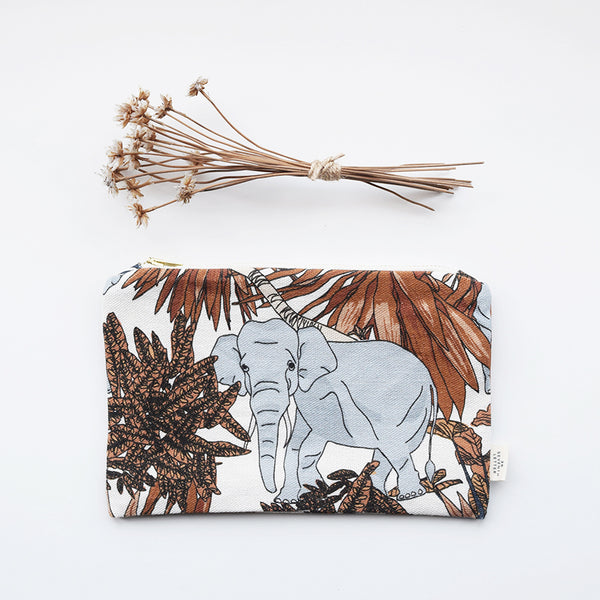 This beautiful zippered pouch with an animal and botanical themed pattern, has been handmade in London from luxurious linen printed in Scotland. 