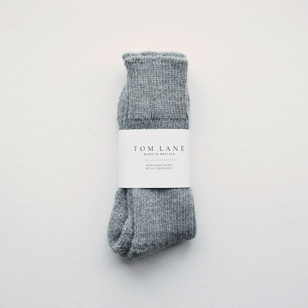 These soft and cosy grey Alpaca socks are perfect for wearing inside your walking boots or wellies! They have a cushion sole for extra comfort and they are breathable to resist moisture. These socks have been made in Nottinghamshire by one of the oldest sock manufacturers in the UK using traditional techniques.