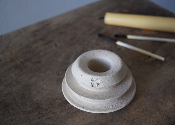 Detail of a hand-thrown stoneware candle holder by Windmill Pottery
