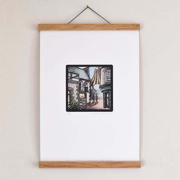 Hanningtons Lane Brighton fine art print displayed in an oak poster hanger