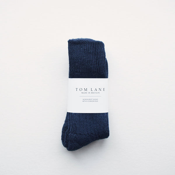 These soft and cosy Alpaca socks in indigo are perfect for wearing inside your walking boots or wellies! They have a cushion sole for extra comfort and they are breathable to resist moisture. These socks have been made in Nottinghamshire by one of the oldest sock manufacturers in the UK using traditional techniques.
