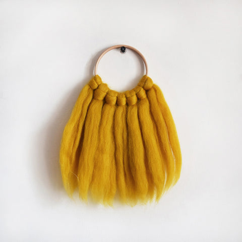 Mini woven wall hanging, designed and handcrafted in the UK from ethically sourced pure merino wool in mustard. 