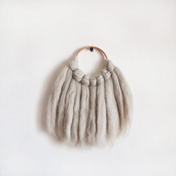 Mini woven wall hanging, designed and handcrafted in the UK from ethically sourced pure merino wool in natural. 