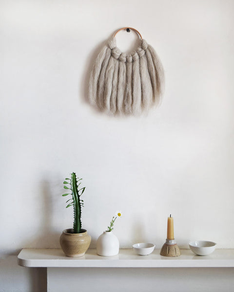 Mini woven wall hanging, designed and handcrafted in the UK from ethically sourced pure merino wool in natural. 