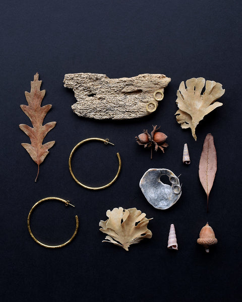 Handmade gold vermeil and Sterling Silver stud earrings, and gold vermeil hoop earrings with a hammered surface inspired by textures found in the natural world.