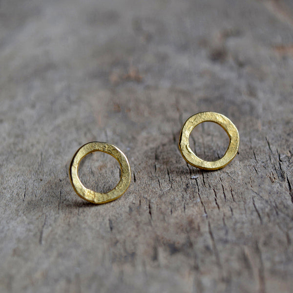 Handmade gold vermeil stud earrings with a matt hammered surface inspired by textures found in the natural world.