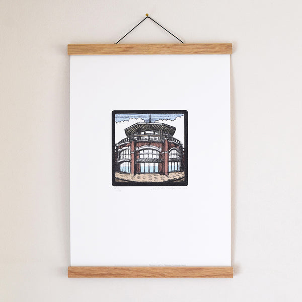 ‘Shelter Hall’ is part of the ‘Brighton Icons’ collection. A series of limited edition art prints numbered 1 to 75 signed by the artist Malcolm Trollope-Davis and produced as an A3 giclee print. Shelter Hall is Brighton's seafront food market featuring seven unique kitchens led by Sussex chefs and two craft beer, wine and cocktail bars.