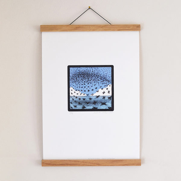 Starling Murmurations Brighton fine art print displayed in an oak poster hanger
