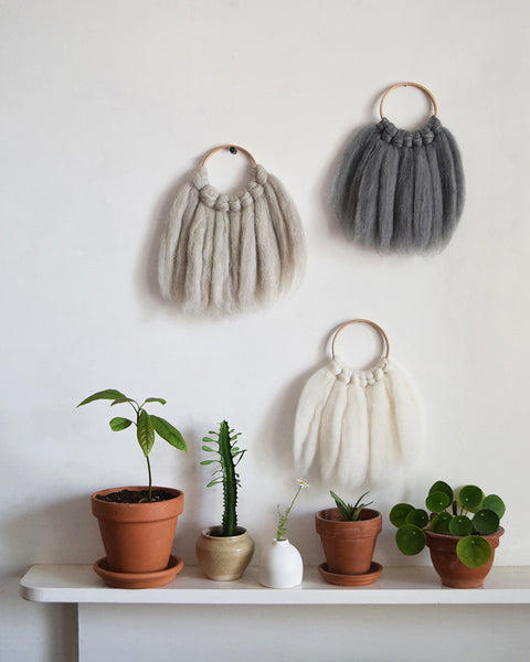 Mini woven wall hanging, designed and handcrafted in the UK from ethically sourced pure merino wool in natural.
