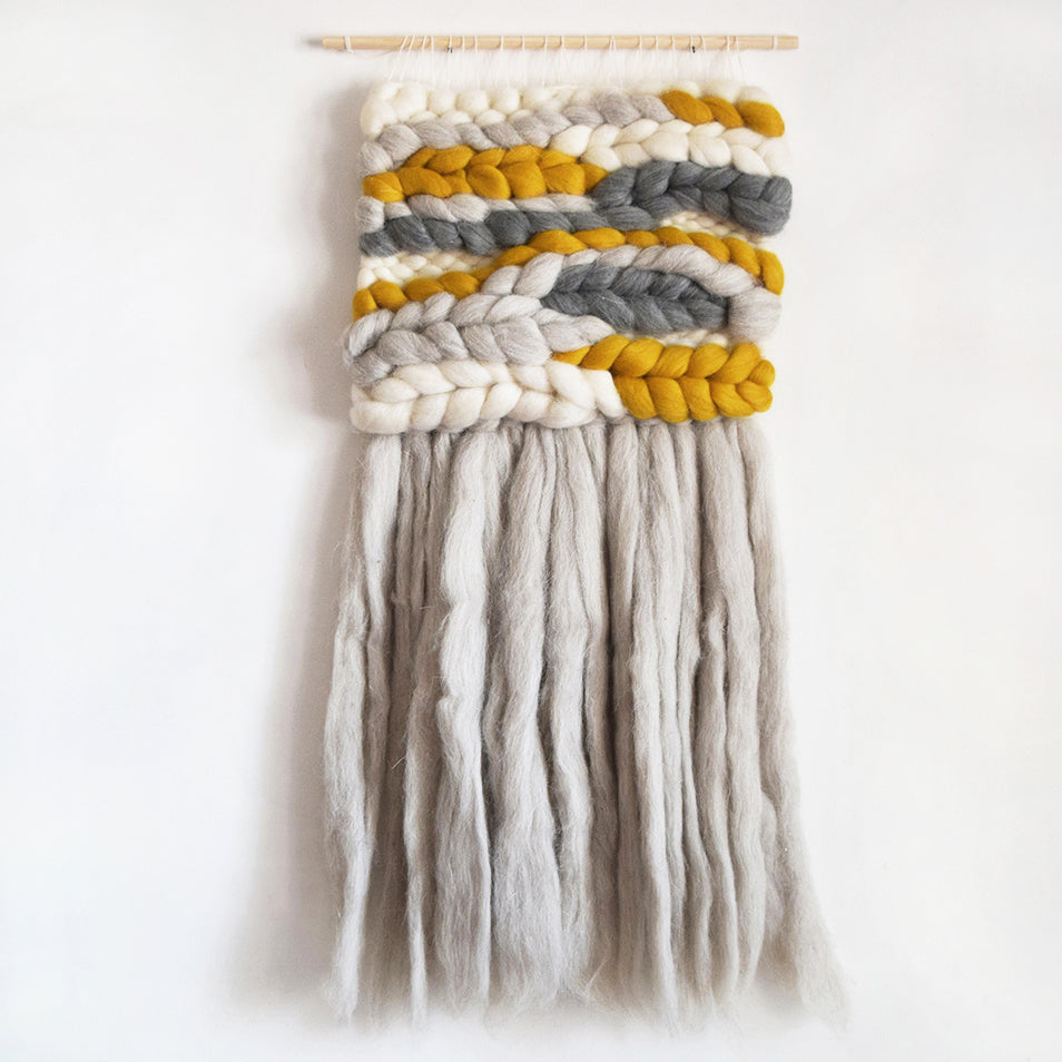 A beautiful woven wall hanging, designed and handcrafted in the UK from ethically sourced pure merino wool.