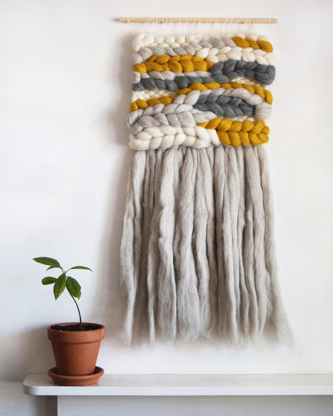 A beautiful woven wall hanging, designed and handcrafted in the UK from ethically sourced pure merino wool.