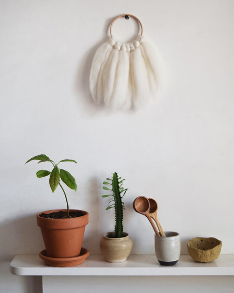 Mini woven wall hanging, designed and handcrafted in the UK from ethically sourced pure merino wool in white.