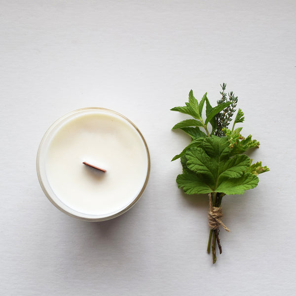 Wild Garden, a botanical aromatherapy candle by Essence and Alchemy, 100% natural, sustainable and eco-friendly. Candles are hand-poured in a British made re-usable mouth-blown glass beaker with a wooden wick. 