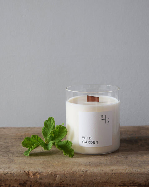 Wild Garden, a botanical aromatherapy candle by Essence and Alchemy, 100% natural, sustainable and eco-friendly. Candles are hand-poured in a British made re-usable mouth-blown glass beaker with a wooden wick. 