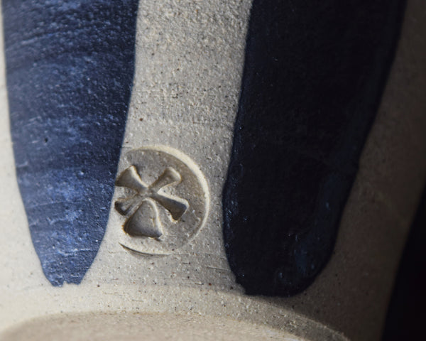 Handmade Windmill Pottery ceramic beaker with a white and cobalt glaze. This beautiful beaker is perfect for coffee, water or whatever you fancy. Made in Sussex from stoneware clay by ceramicist Anna Sandberg.