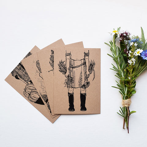 A beautiful set of postcards featuring mini prints hand carved from original linocut and woodcut prints by Rosanna Morris. The postcard designs include 'Boots', 'Flower Harvest', 'Mary' and 'Wheelbarrow'. 