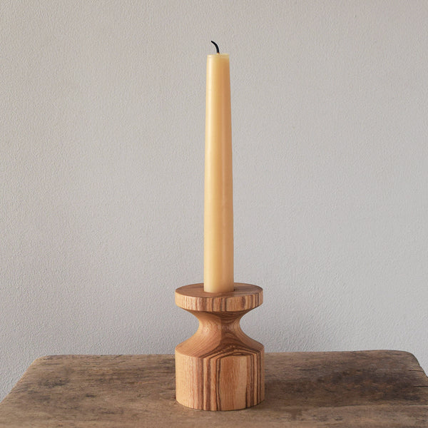 Handcrafted Wooden Candleholder by Selwyn House. Each candlestick is turned from a single piece of Ash. The weight of the wooden base means the candlestick is steady and sturdy. Free gift wrapping and shipped using eco-friendly packaging.