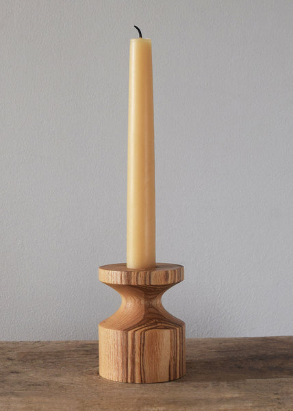 Handcrafted Wooden Candleholder by Selwyn House. Each candlestick is turned from a single piece of Ash. The weight of the wooden base means the candlestick is steady and sturdy. Free gift wrapping and shipped using eco-friendly packaging.
