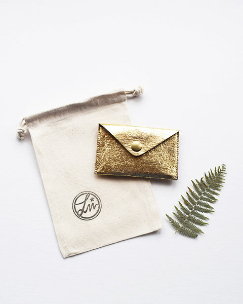 Handcrafted vegan leather gold card holder made in Belgium by Grey Whale.