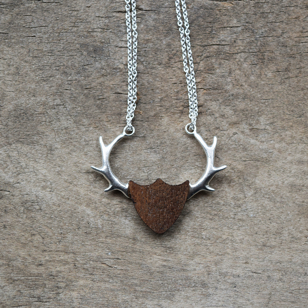 Inspired by nature, this beautiful silver antler shield necklace has been designed and handcrafted in a studio in Lewes by Phoebe Jewellery. It’s made from sterling silver and each shield is unique and crafted from reclaimed mahogany. 