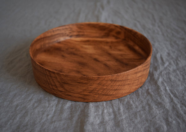 Each of these wooden trays by Selwyn House has been hand-turned from a single piece of solid Brown Oak, and finished in food-safe Danish Oil. With a weighty base but delicate edges, they're as useful as they are beautiful.